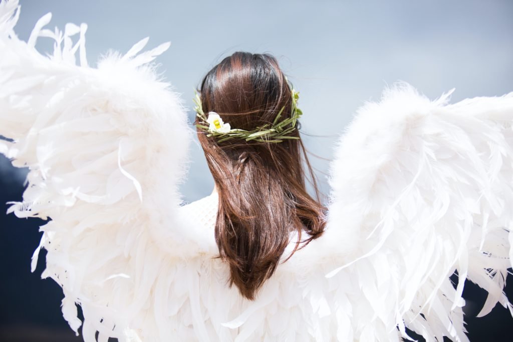 a picture of a girl with angel wings by Sommi H @unsplash