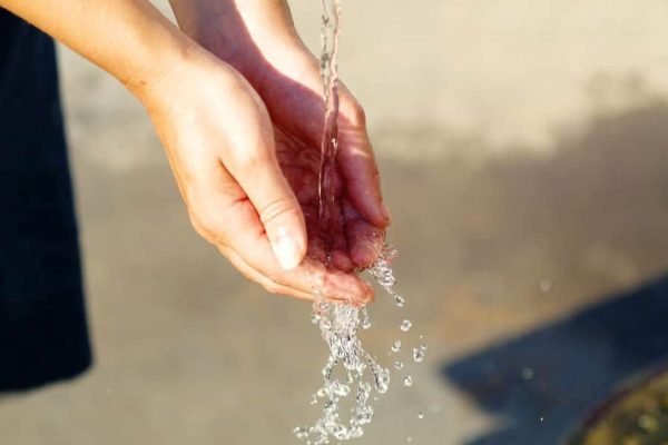 hands with water splashing...